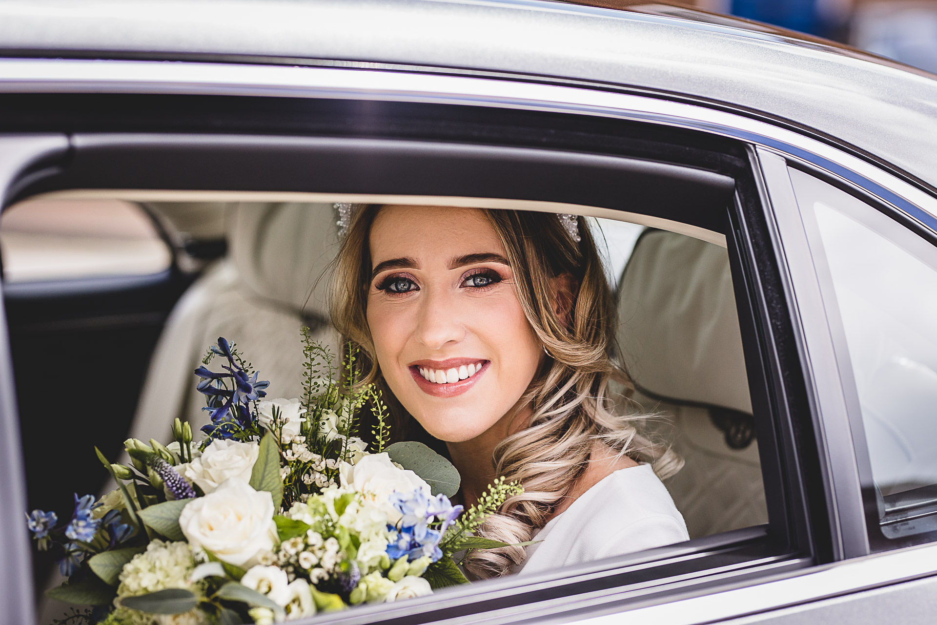 Bride in a car arriving at ceremony in Poole, Dorset