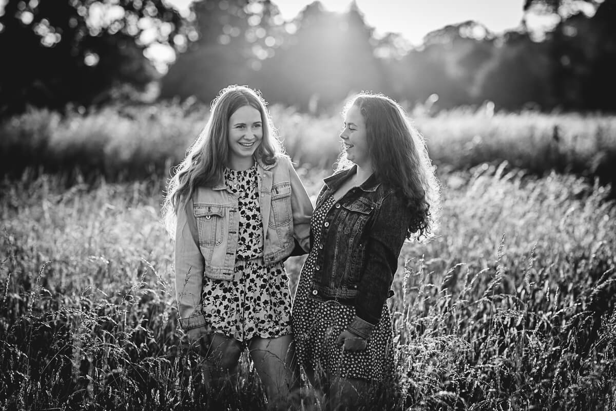 Black & White portrait of two sisters laughing in Dorset