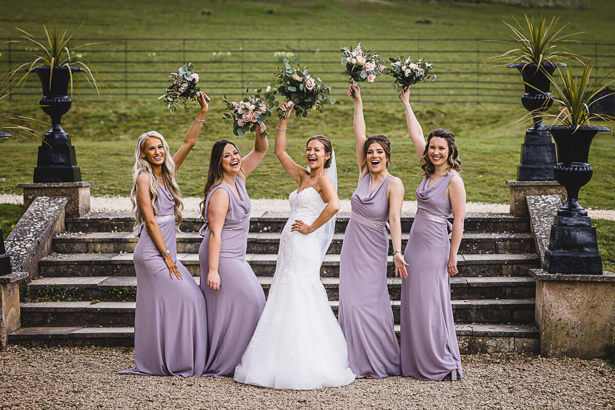 Bride and bridesmaids laughing at Crowcombe Court Wedding, Somerset