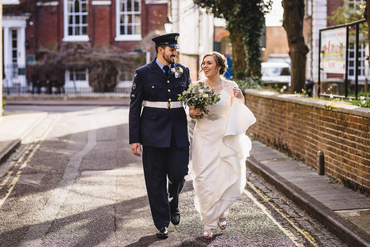 Bride and Groom walking along near the Guildhall in Poole