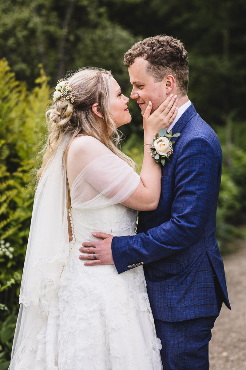 Bride & Groom gazing into each others eyes at The Walled Garden in Moreton, Dorset